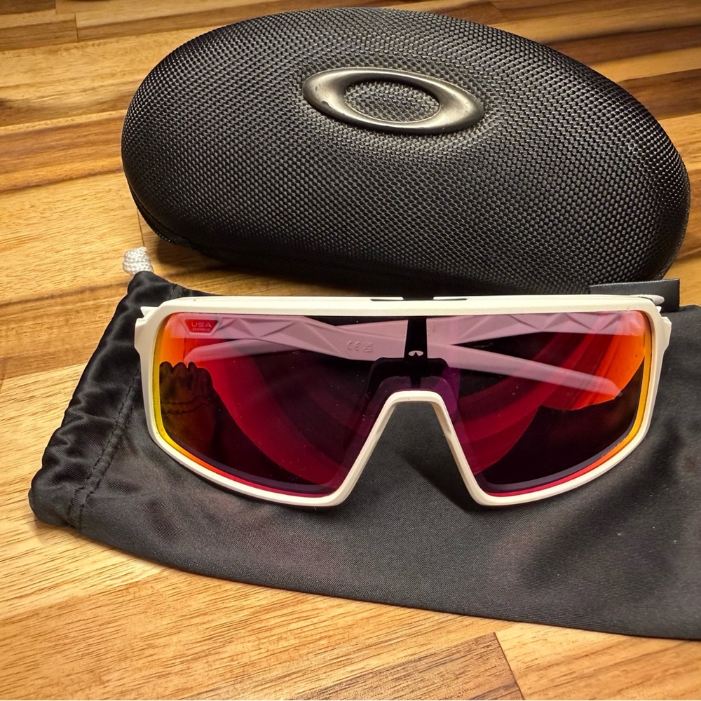 Oakley White Frame Sunglasses with Red-Tinted Lenses